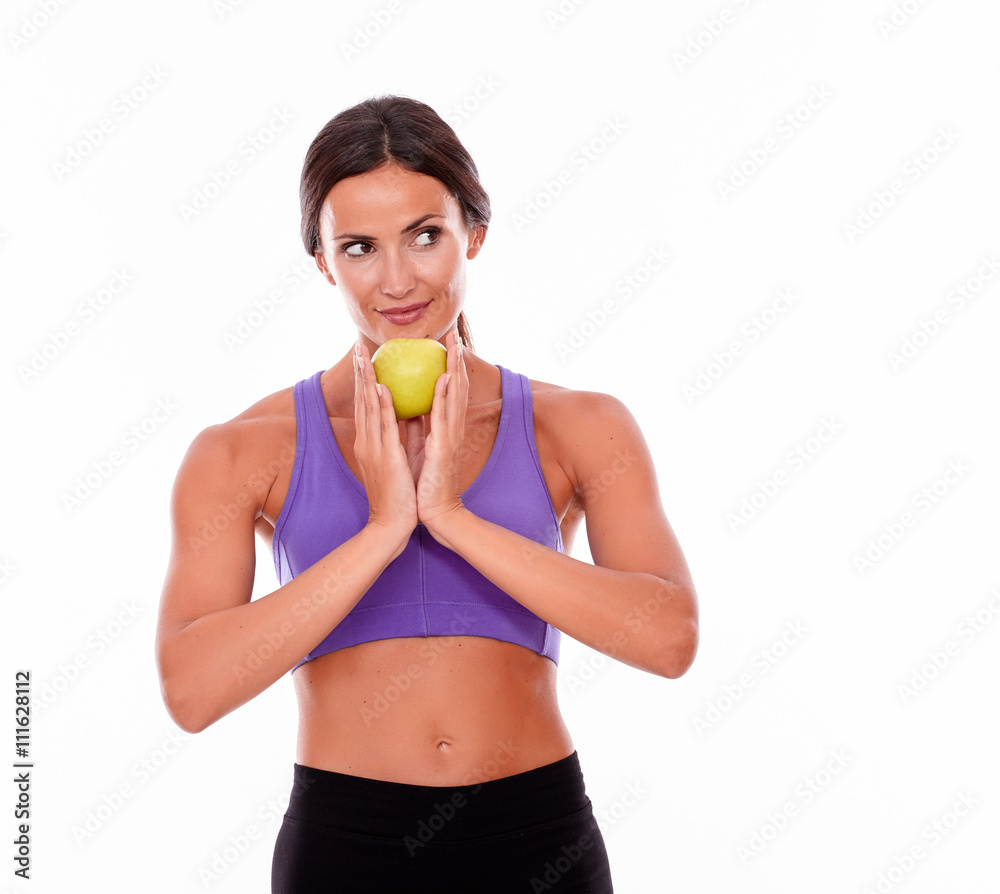 Healthy smiling brunette with an apple Healthy smiling brunette with an apple