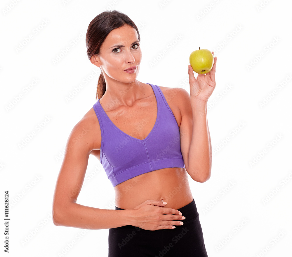 Healthy smiling brunette with an apple Healthy smiling brunette with an apple
