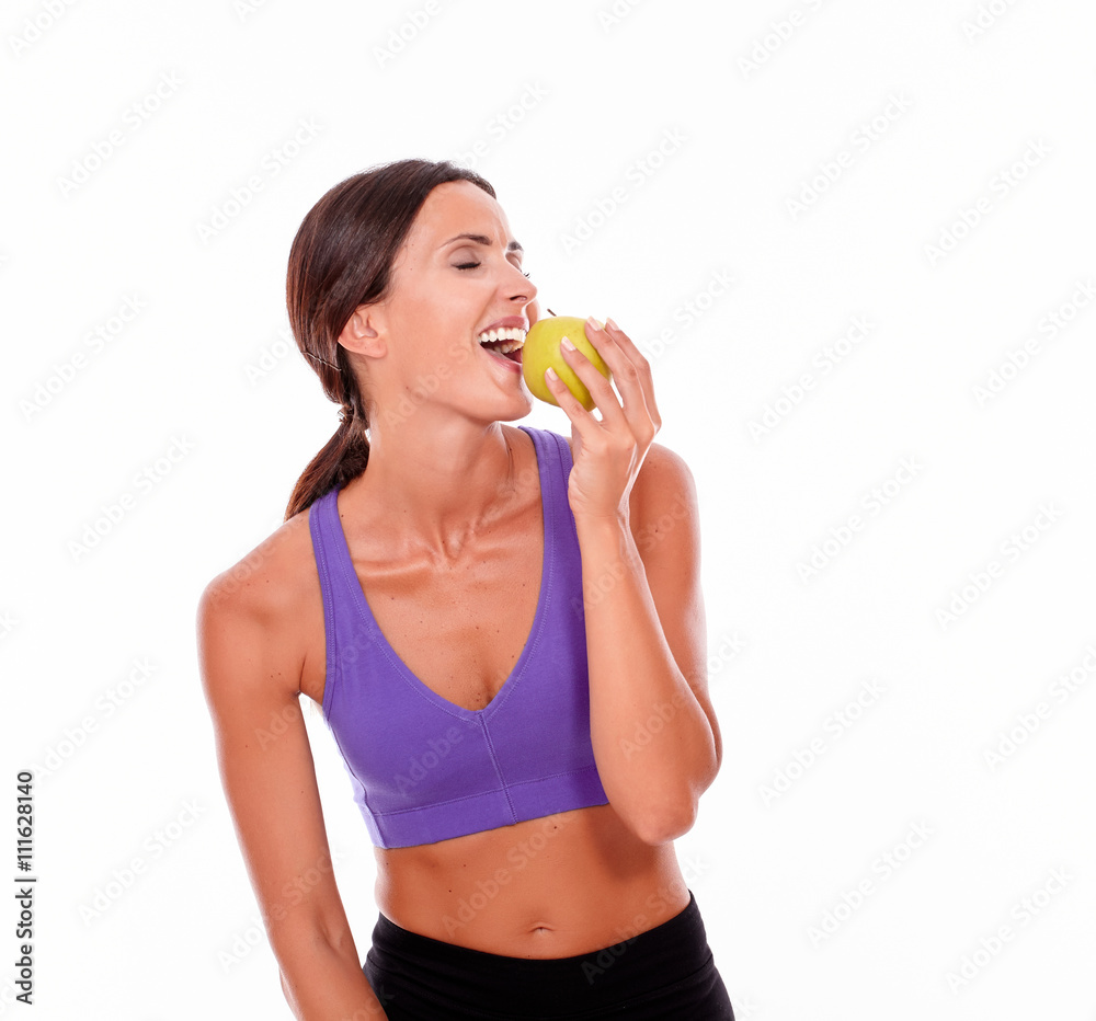 Healthy smiling brunette with an apple Healthy smiling brunette with an apple
