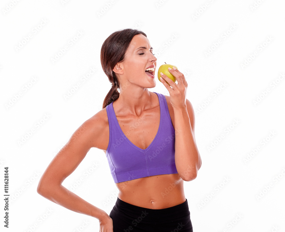Healthy smiling brunette with an apple Healthy smiling brunette with an apple