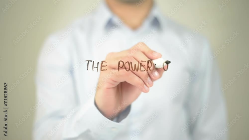 The Power Of Branding, man writing on transparent screen The Power Of Branding, man writing on transparent screen