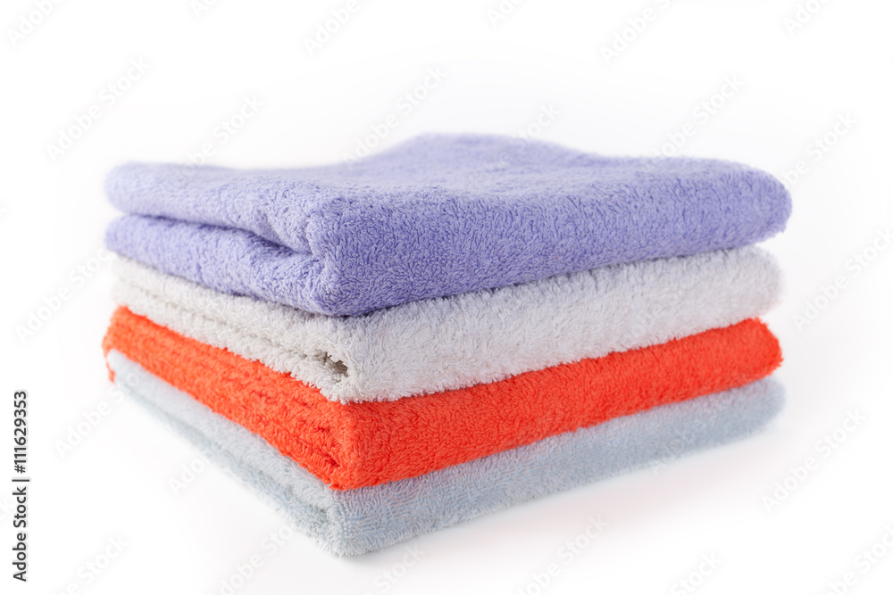 Four colorful towels on white background Four colorful towels on white background