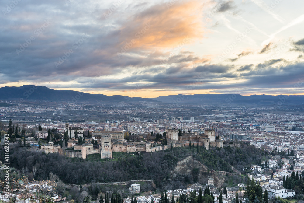 Sunset at Granada - The panorama of Alhambra palace and fortress complex at dusk. Andalusia. Spain