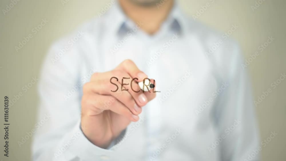 Secret , man writing on transparent screen Secret , man writing on transparent screen