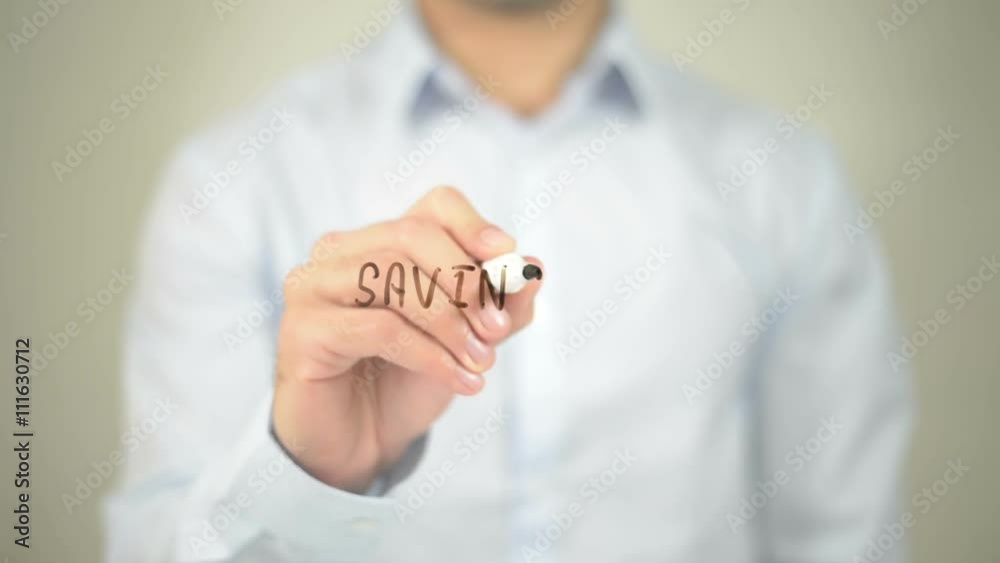 Savings , man writing on transparent screen Savings , man writing on transparent screen