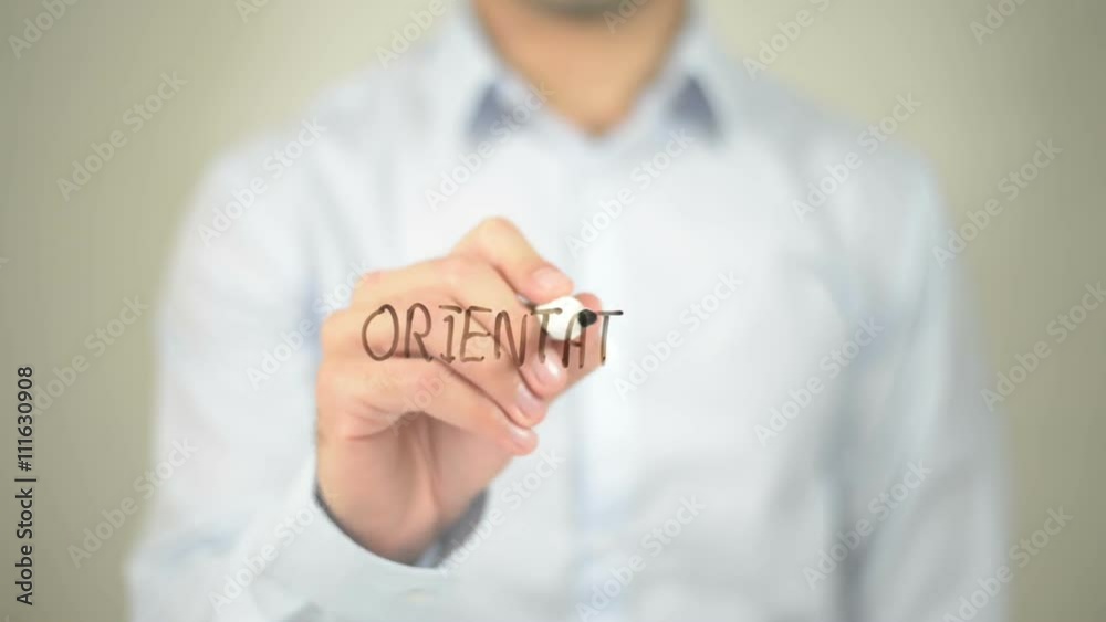 Orientation , man writing on transparent screen Orientation , man writing on transparent screen