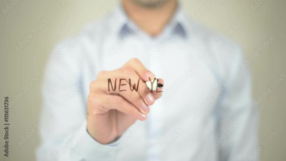 New Year, man writing on transparent screen New Year, man writing on transparent screen