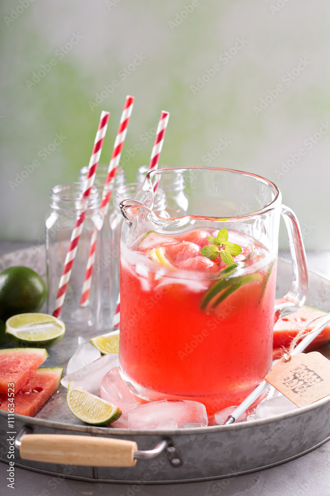 Watermelon drink with lime in a pitcher Watermelon drink with lime in a pitcher