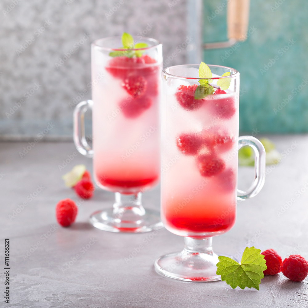 Pink raspberry lemonade in tall glasses Pink raspberry lemonade in tall glasses
