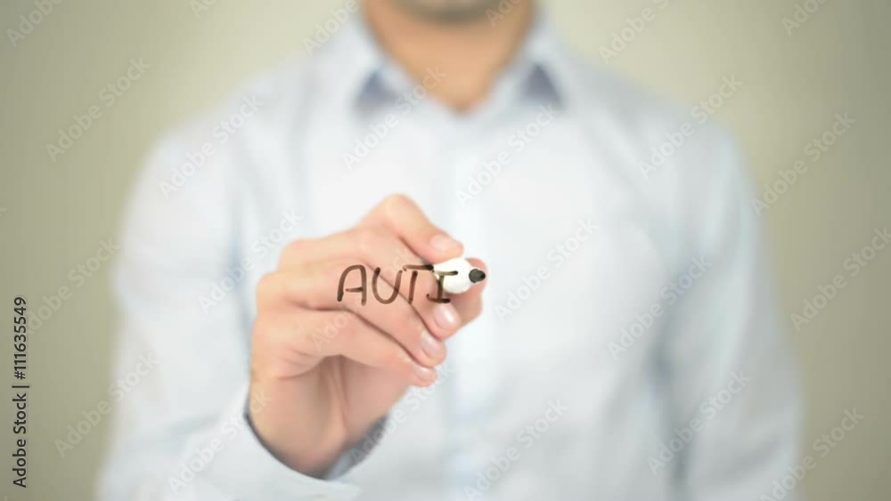 Autism, man writing on transparent screen Autism, man writing on transparent screen