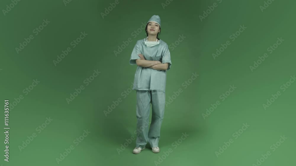 young asian adult woman doctor surgeon isolated on green-screen background smiling confident young asian adult woman doctor surgeon isolated on green-screen background smiling confident