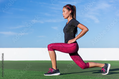 Fitness woman doing lunges exercises for glute and leg muscle workout training core muscles, balance, cardio and stability. Active crossfit girl doing front forward one leg step lunge exercise.