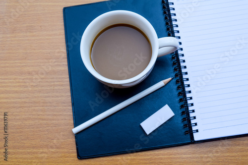 office tatle with cup of coffee