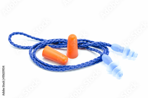 Photography Blue and orange earplugs with a string on white background.