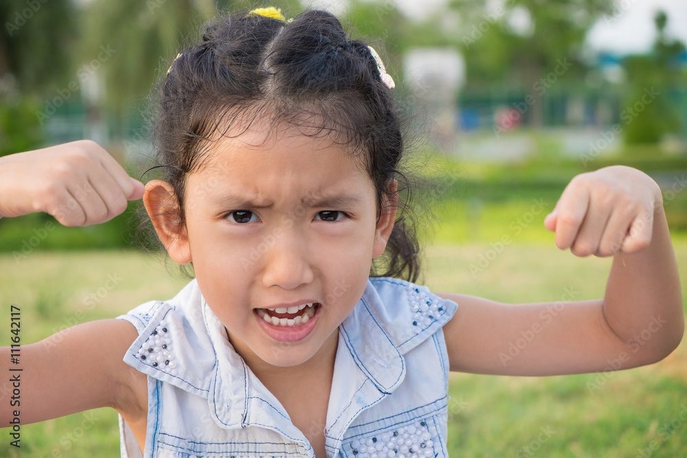 Close up portrait of a asia little girl with an angry expression Close up portrait of a asia little girl with an angry expression