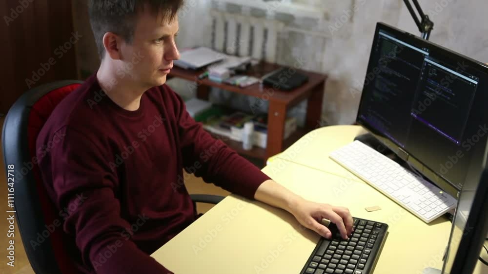 Programmer working on the computer. Edit program code