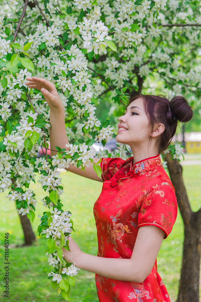 Beautiful asian girl in traditional chinese red dress. Beautiful asian girl in traditional chinese red dress.