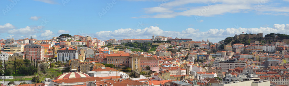 Panoramic view from the Miradouro de Sao Pedro Alcantara including Castelo de Sao Jorge, Igreja da Graca and Miradouro de Graca. Lisbon
