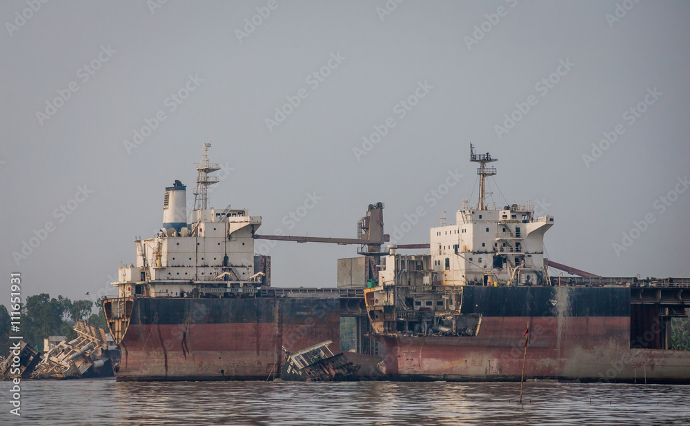 partially broken down ocean ships at a shipbreaking yard in Chittagong, Bangladesh