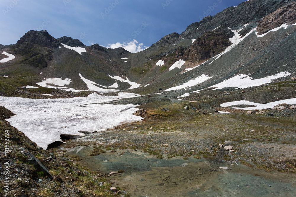 Mountain peaks covered with melting snow. Spring in high mountai