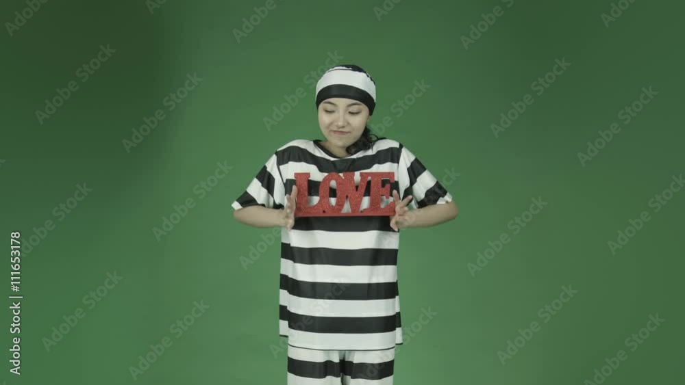young asian adult woman prisoner isolated on green-screen background happy in love young asian adult woman prisoner isolated on green-screen background happy in love
