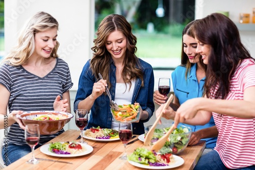 Smiling friends having food