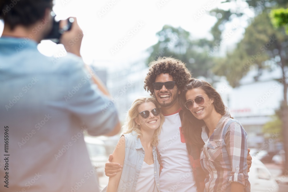 Man taking photo of his friends Man taking photo of his friends