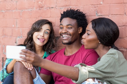 Photography Friends taking selfie on a mobile phone