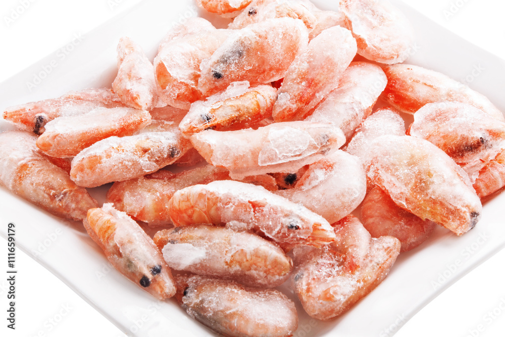 Frozen shrimps on a square dish, isolated on white Frozen shrimps on a square dish, isolated on white
