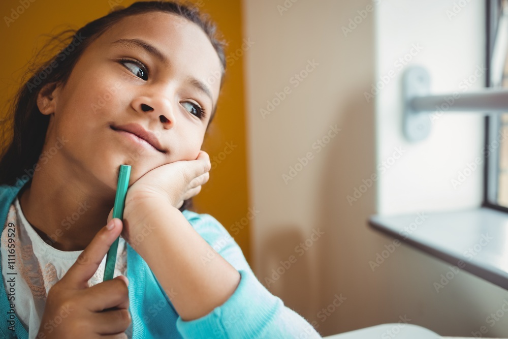 Girl sitting at a desk Girl sitting at a desk
