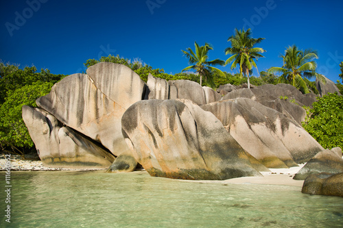 Seychelles, La Digue island beach, granite rocks, palm trees