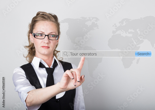 tour operators written in search bar on virtual screen. Internet technologies in business and home. woman in business suit and tie, presses a finger on a virtual screen