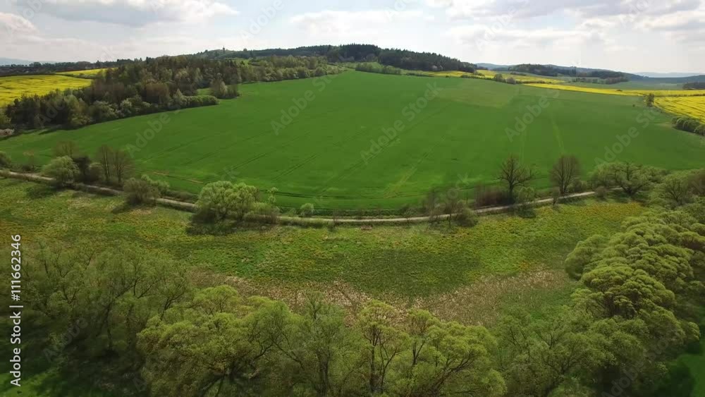 Aerial video of western Bohemia countryside with trees, meadows and colza fields Aerial video of western Bohemia countryside with trees, meadows and colza fields