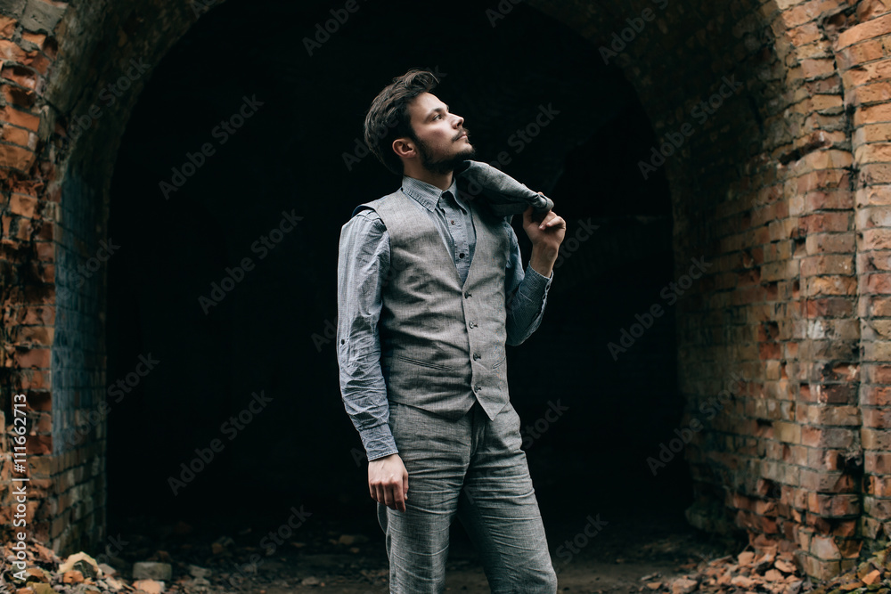 Portrait Elegant bearded vintage retro young handsome Businessman man hipster with mustache, Outdoor, jacket, ruins