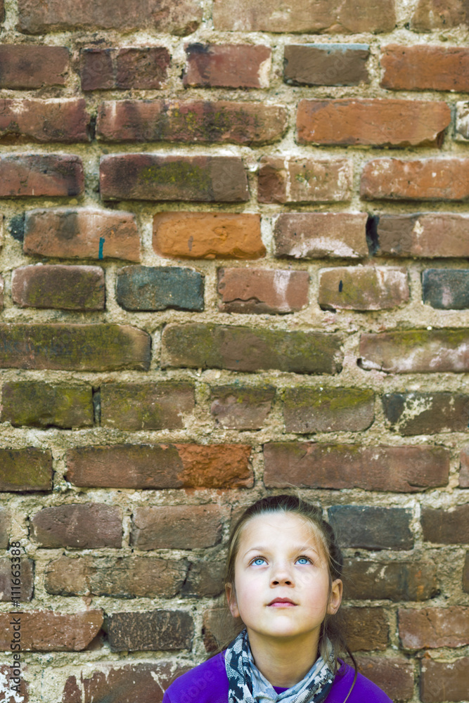 girl looking up wall