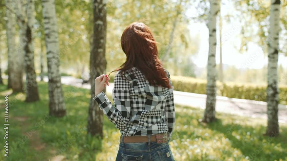 girl walking in the park girl walking in the park