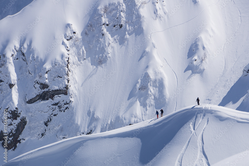 Snowboard freeride, snowboarders and tracks on a mountain slope. Extreme winter sport. Snowboard freeride, snowboarders and tracks on a mountain slope. Extreme winter sport.