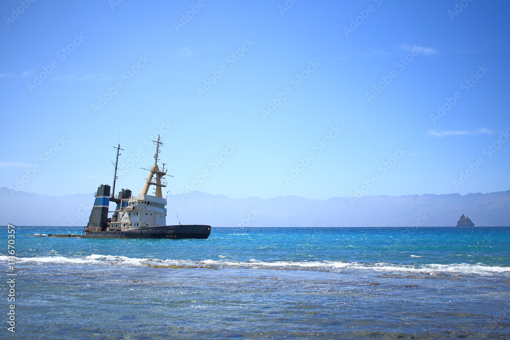 Sunken and abandoned ship near the island