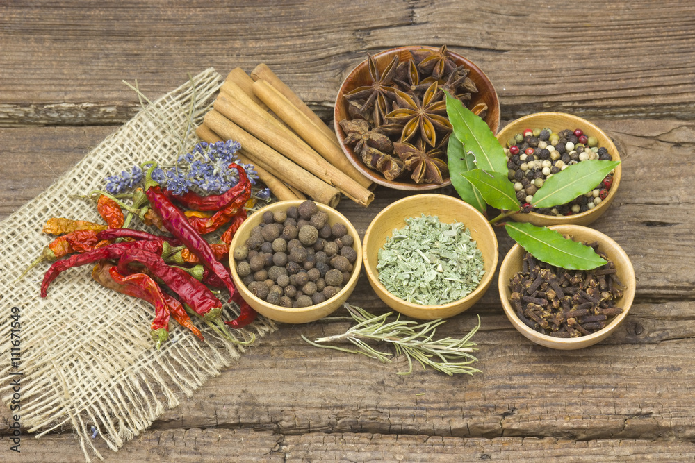 Variety of spices on wooden background