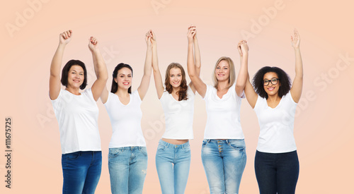 group of happy different women in white t-shirts