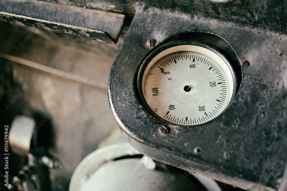 Old abandoned industrial engine that was used in mining industry in the past. Detail of non-working pressure dial without needle Old abandoned industrial engine that was used in mining industry in the past. Detail of non-working pressure dial without needle