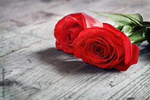 Red roses on wood