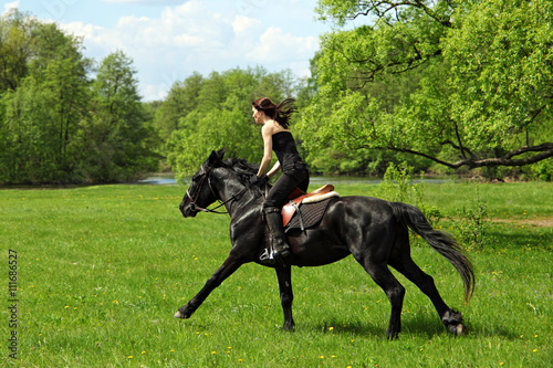 Young woman on horse - afternoon trail ride 
