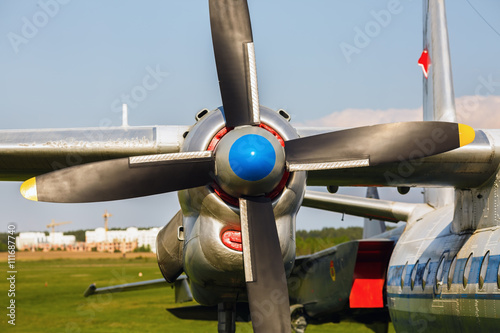 Old turboprop transport aircraft. Engine and propeller of the old retro transport plane close-up. Fragment of the aircraft.