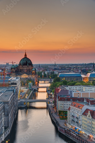 The Spree river in Berlin with the cathedral at sunset