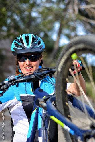 happy woman riding mountain bike
