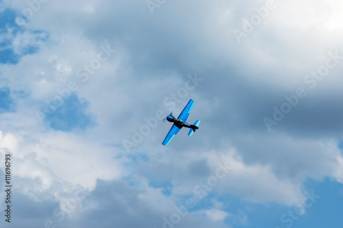 Aerobatics in the blue sky with clouds