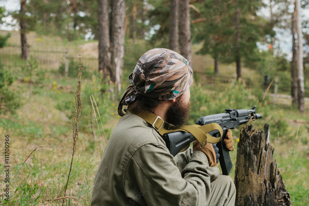 Armed man in a zone of armed conflict Armed man in a zone of armed conflict