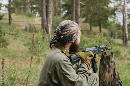 Armed man in a zone of armed conflict