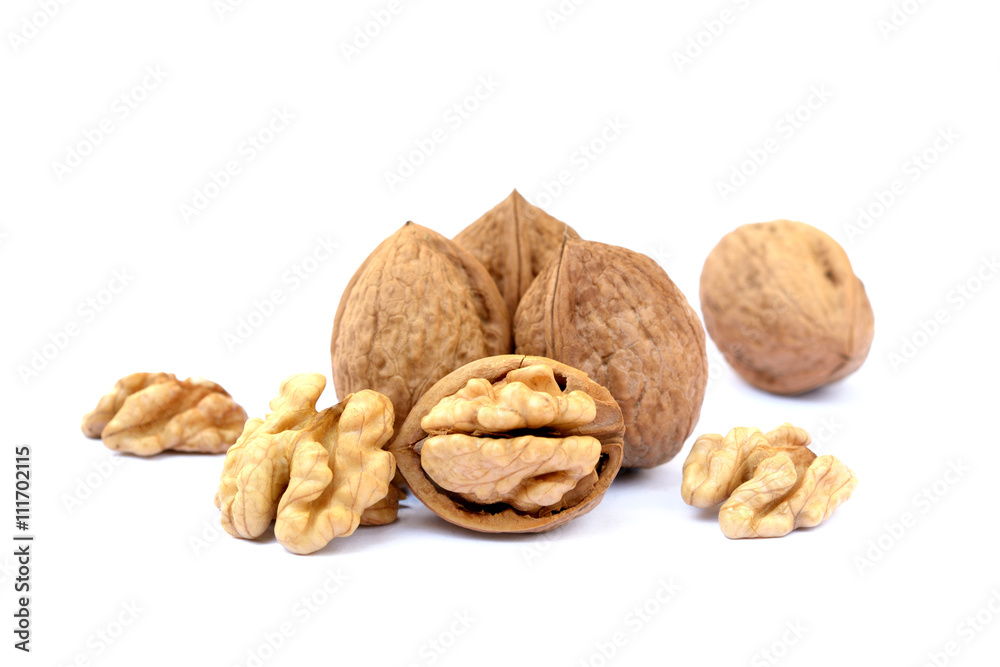 Fresh walnuts with a shell isolated on white background Fresh walnuts with a shell isolated on white background